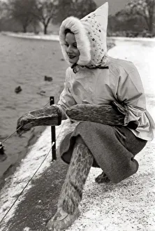 A woman dressed in a strange outfit including matching boots