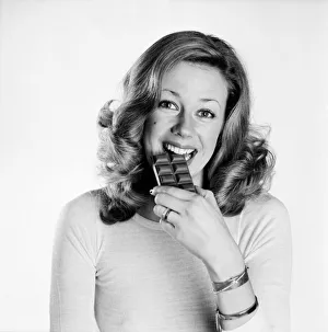 00048 Prints: Woman eating chocolate. February 1975 75-00891-002