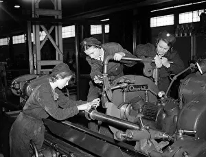Woman Engineers working a lathe 1941 women doing mens jobs during the war years