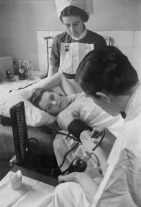 00073 Prints: A woman giving blood at her doctors surgery during the Second World War as a nurse