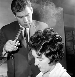 Woman have her hair cut and curled at the hair dressers, 7th June 1962