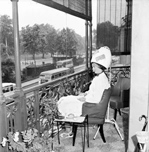 Woman Hairdressers A Client at Mr Freddie Frenchs Park lane balcony hairdressing