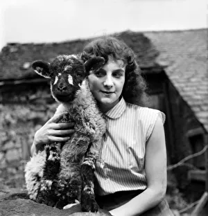 Lamb Prints: Woman and Lamb. 20yrs old Margaret Harrison of Stalybridge Cheshire with her pet lamb