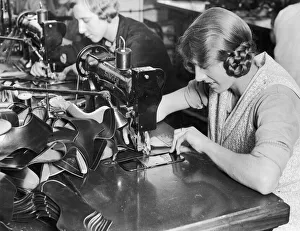 Shoes Prints: A woman machinist seen here of the factory floor of J Searsy of Northampton sewing uppers