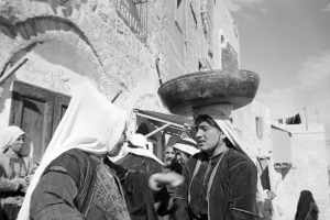 Core80 Prints: A woman in the market at Bethlehem with a bowl balanced on her head Circa 1935