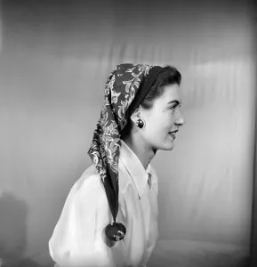 00061 Prints: Woman modeling several ways of wearing a head scarf. April 1953