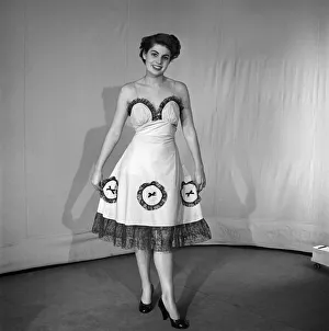 00061 Prints: Woman modelling the latest evening dress fashions in the Reveille studios