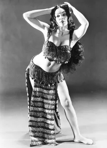 Woman performs her belly dance in traditional costume of beaded
