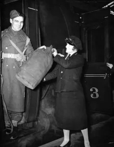 01448 Prints: A woman railway porter at work during World War II. Circa 1941