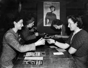 A woman registers for war work at the Burnt Oak labours exchange after they marked