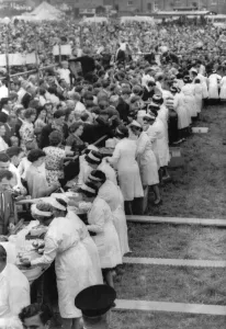 Eating Out Prints: Woman serving portiosn of the world famous Denby Dale Pie