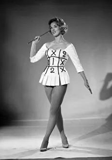 Woman (Shelia Robens) seen here dress in football costume. 1957