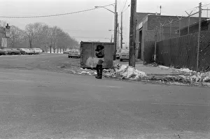 Cold Prints: A woman standing in the road in New York, wearing bikini pants and leggings