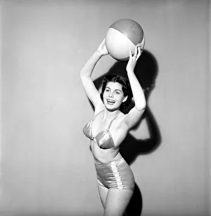 Woman in Swimming costume holding beach ball. 1960 E67-001