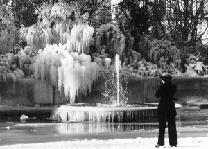 A woman takes picture of frozen fountain at Marble Arch January 1982