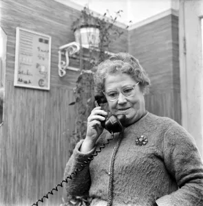 Woman talking on the telephone in her home. December 1969 Z11754-001