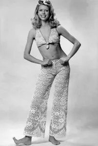 Woman wearing a bikini top and lace see through trousers June 1974 P018056