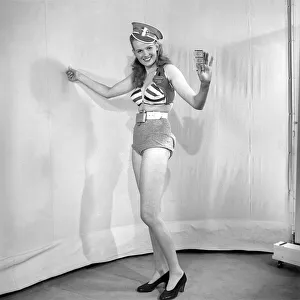 Woman wearing fancy dress bus condutors uniform. 1959