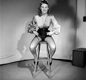 Woman wearing fancy dress jockey outfit. 1959