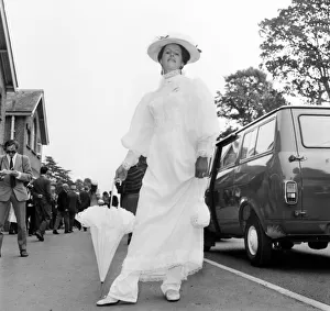 00044 Prints: Woman wearing long white dress with matching hat and umbrella on the first day of Royal