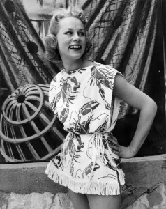 Woman wearing a patterned sleeveless short skirted outfit for a day out to the beach