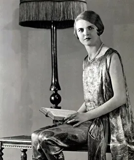 00371 Prints: woman wearing pearl necklace and silk dress with sash tied around her wais