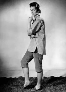 Gesture Prints: Woman wearing three quarter length trousers and loose fitting shirt