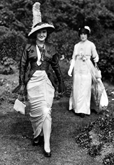 Old Fashion Prints: Woman wearing a slit skirt dress ans unusual hat during Royal Ascot, June 1913