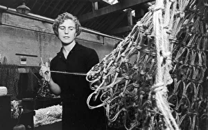 Northern Ireland Prints: A woman at work in the sheds at the Belfast Ropeworks Company which is the largest