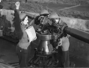 Women of the ATS operating the height finder optics at an anti aircraft battery in
