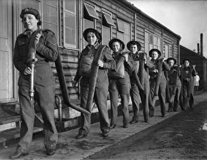 Firefighters Collection: Women of the ATS who are operate the height finder optics at an anti aircraft battery in
