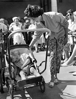 00036 Prints: Women: Beauty contest. What all the fuss about as Kenneth Burnett a baby of two sleeps