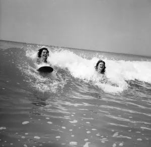 Women body boarding in the surf at Newquay June 1960 M4303-004