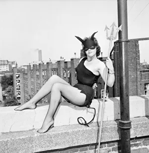 Skimpy Prints: Women dressed as She Devil. Model: Pamela Dennis. May 1957 E270