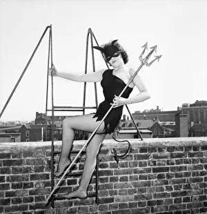 Women dressed as She Devil. Model: Pamela Dennis. May 1957 E270-003