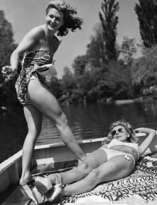 Two women enjoying the sun whilst cruising up the River Thames July 1948