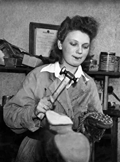 00113 Prints: Women Industry 1940 s. Usually Sylvia Smith, 21 yrs ols woman cobblar os Crowe sings