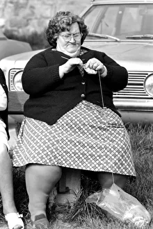 Gossip Prints: A women with larger figure seen here knitting whilst their children play in a poorer