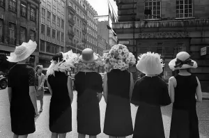 00196 Prints: Women modelling hats for the 1966 Royal Ascot festiva - back view of the floral hatsl