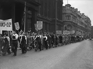 Women munition workers parade through central Birmingham as part of War Production Worker