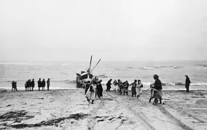 Crew Prints: Women pull the lifeboat ashore at Cresswell lifeboat station in Northumberland