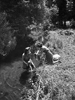 Rural Scene Prints: Two women washing their clothes in the River Chess at Broadwater Bridge near Chesham