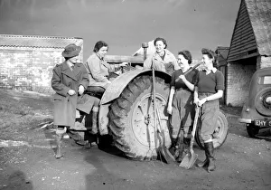 Agriculture Prints: Womens Land Army girls with a tractor probably taken on farms in North Somerset