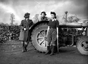 Womens Land Army girls with a tractor probably taken on farms in North Somerset
