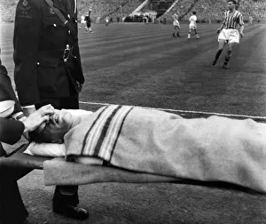 Wood, R. Play continues whilst ambulance men trying to stop the bleeding from his nose is