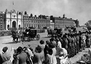 Woolwich: General view showing horses walking between ranks of cheering troops