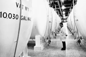 A worker at the Black and White whisky blending and bottling plant in Stepps in Scotland