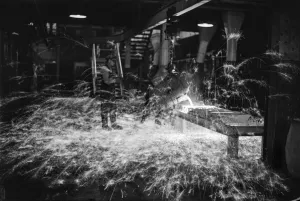 Sparks Prints: A worker casts components from molten metal at the new one million pound furnace
