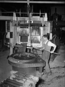 One Man Only Prints: A worker at K & L Steel Founders and Engineer Limited seen here preparing a furnace for