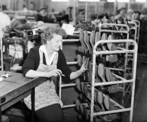 Shoes Prints: A worker at the Mansfield shoe factory in Northampton seen here trimming shoes 26th April